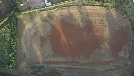 Aerial-top-down-view-on-soccer-pitch-in-Loitokitok,-Kenya,-match-of-two-amateurs-teams
