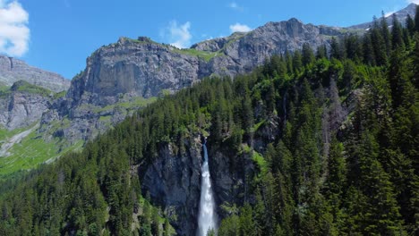 Swiss-alps-hidden-waterfall-of-staubifall,-epic-aerial-pullback-orbit