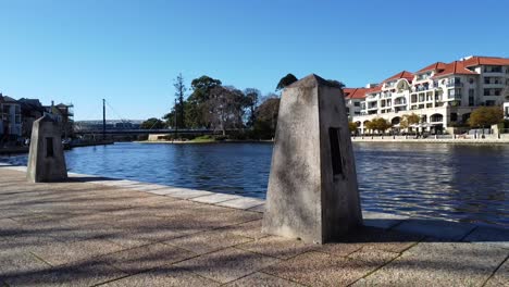 Drone-Aerial-View-descending-down-to-pavement-of-Claisebrook-Cove,-East-Perth-and-Swan-River,-Western-Australia