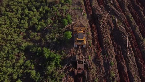 Aerial-drone-shot-of-Soil-Prepartion-machines-turning-forest-land-into-agriculture-land-of-Posadas-in-Misiones-Argentina