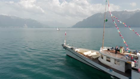 Drone-flying-past-beautiful-old-cruise-ship-on-Lake-Geneva