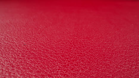 Abstract-pattern-of-wrinkles-on-red-cow-leather-surface