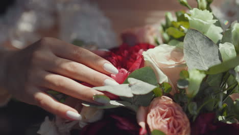 Fiance-with-white-nails-strokes-gentle-bouquet-with-eustomas