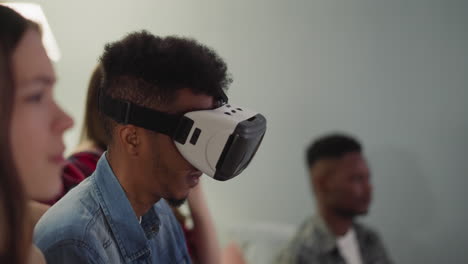 Black-man-with-VR-goggles-and-young-friends-enjoy-match