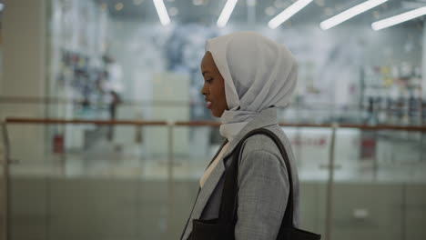 Happy-African-American-lady-with-hijab-in-shopping-mall