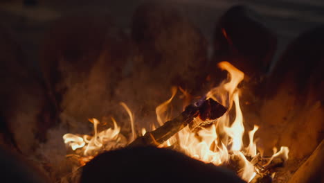 Fire-burns-in-special-bowl-at-night-closeup-slow-motion