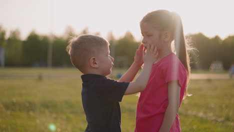 Little-brother-strokes-girl-with-injured-eye-at-countryside