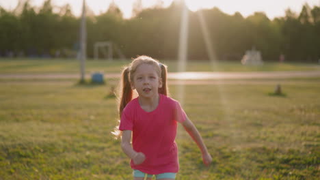 Funny-blonde-girl-with-tongue-out-runs-along-playground