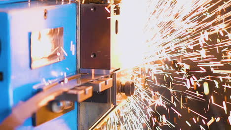 powerful-machine-welds-long-metal-band-saw-in-workshop