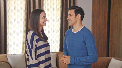 Cute-and-happy-Indian-couple-talking-to-each-other