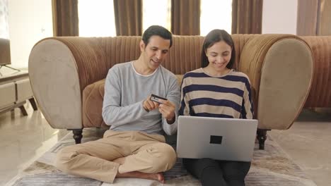 Happy-Indian-couple-doing-online-shopping