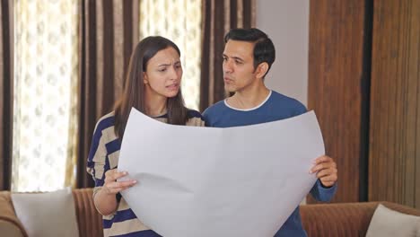 Indian-couple-discussing-house-plan