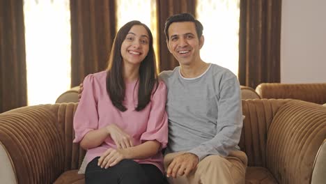 Happy-Indian-couple-talking-to-the-camera