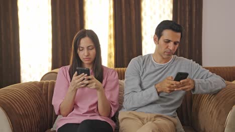 Indian-couple-busy-in-their-phones