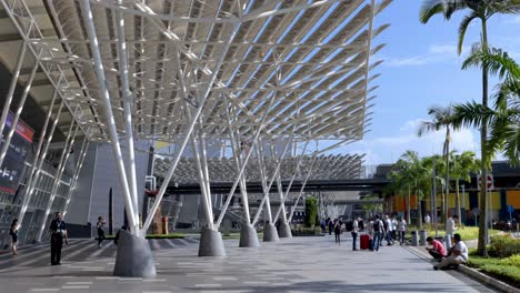 Architectural-Detail-Of-The-Entrance-Of-Singapore-Expo-Convention-Center-With-People-Outside-The-Building
