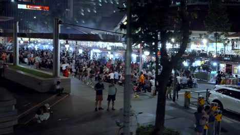 Crowded-Food-Street-At-Night-In-Bustling-Financial-District-Of-Singapore