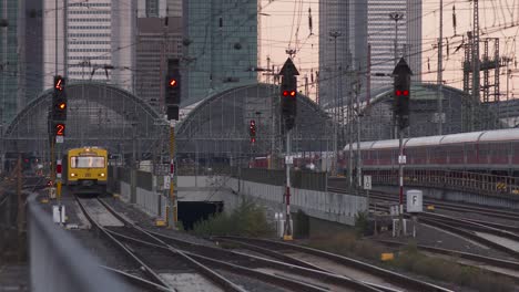 Railway-station-Frankfurt,-Germany-in-the-evening,-skyline-with-skyscrapers