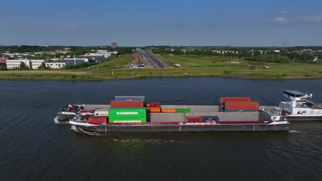 Side-view-of-the-cargo-ship-Marla-Duo,-across-the-river-at-Gravendeel