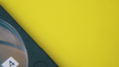 old-compact-cassette-with-number-four-on-yellow-background