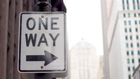 Close-up-of-a-one-way-sign-in-the-downtown-area-of-Chicago