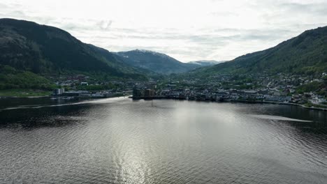 Sogndal-Norway---Backlit-evening-aerial-above-sea-during-late-spring-months