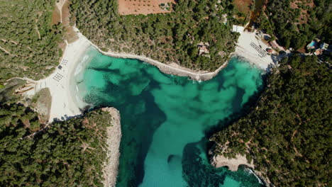 Aerial-View-of-Cala-Mondrago-and-S’Amarador-Beach-With-Clear-Blue-Waters-in-Mallorca,-Spain