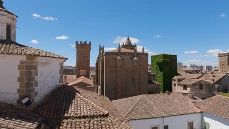 Rooftop-view-panning-across-scenic-Cáceres-town-buildings-from-the-church-of-San-Francisco-Javier-over-monumental-city-skyline