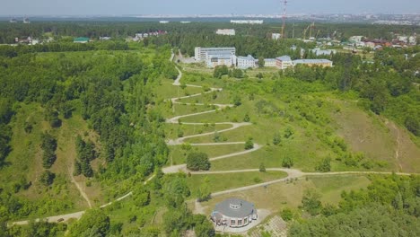 green-hill-with-path-on-hairpin-curves-on-nice-day-aerial