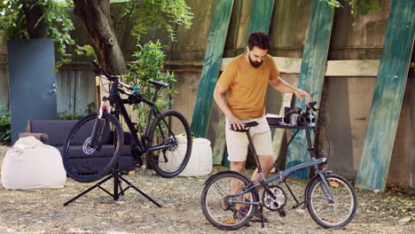 Man-ensuring-bicycle-function-in-yard