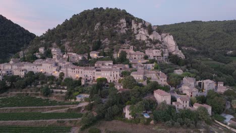 Aerial-Drone-shot-Vaucluse-Provence-Seguret-Medieval-Town-Vineyards-Sunset-France