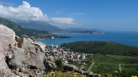 Mediterranean-town-from-above,-sea-and-mountains,-establishing-shot,-Montenegro