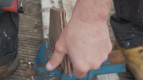 A-carpenter-hand-planing-scarf-on-plywood