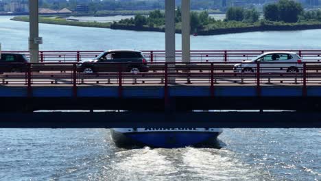 A-barge-passes-below-the-A15-bridge-outside-Alblasserdam-in-the-Netherlands