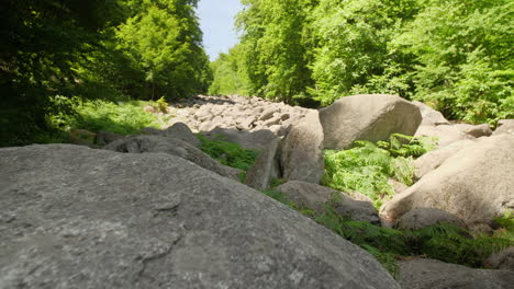 Felsenmeer-in-Odenwald-Sea-of-rocks-Wood-Nature-Tourism-on-a-sunny-day-seady-movement