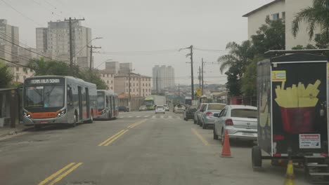 Pov-drive-on-smoky-road-in-Sao-Paulo-City-during-dense-clouds-in-poor-area,-Brazil