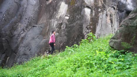 Man-walking-up-the-steps-of-the-cliff