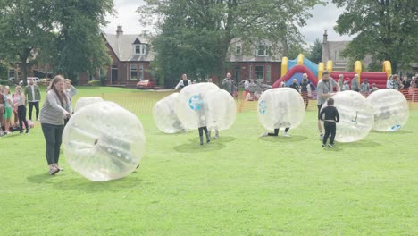 Children-playing-with-giant-zorbing-balls