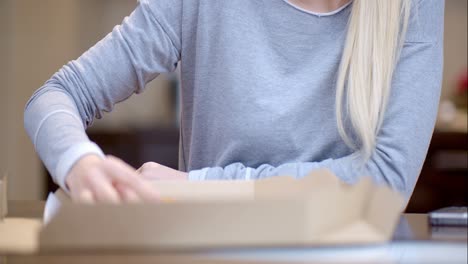 Attractive-woman-enjoying-a-slice-of-pizza