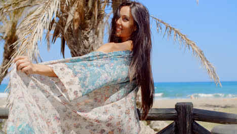 Carefree-Woman-at-the-Beach-Looking-at-Camera