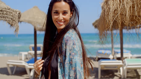 Smiling-Woman-at-the-Beach-Looking-at-Camera