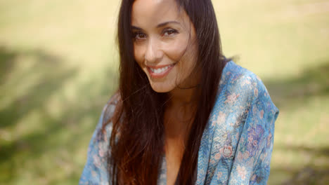 Smiling-Lady-at-Grassy-Ground-Looking-at-Camera