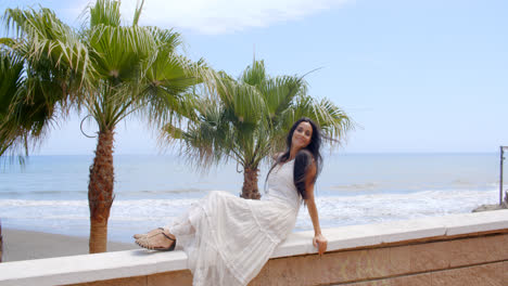 Young-Lady-Relaxing-on-Balcony-Rails-at-the-Beach