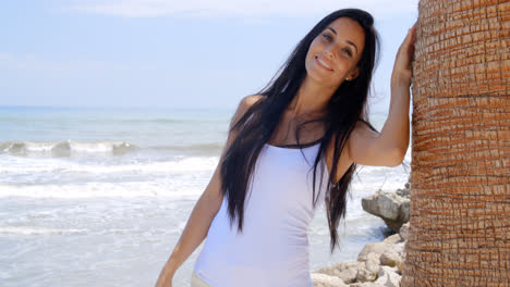 Lady-Leaning-her-Head-Against-Beach-Palm-Tree