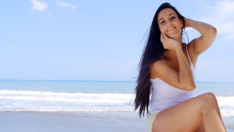 Portrait-of-Woman-Sitting-in-Shade-on-Beach