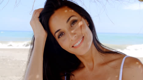 Brunette-Woman-in-Shade-on-Tropical-Beach