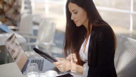 Pretty-businesswoman-working-on-a-tablet