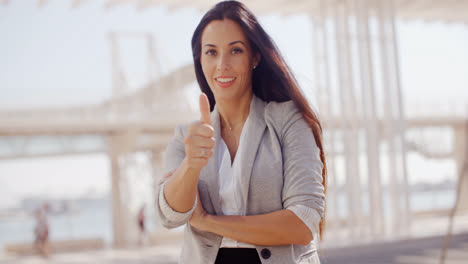 Motivated-young-woman-giving-a-thumbs-up