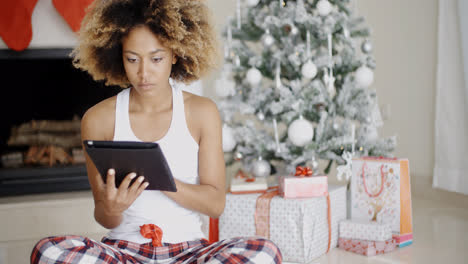 Young-woman-attending-to-Xmas-social-media