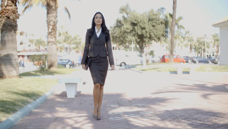 Lady-In-A-Suit-Walking-Down-The-Street