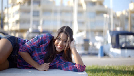 Girl-Lying-On-A-Park-Bench